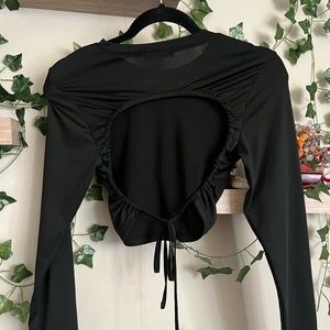 black long sleeve crop top, backless with a tie in the back